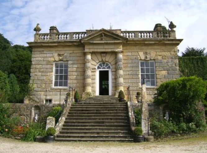 Ebberston Hall, a classical stone Palladian villa with a grand central staircase